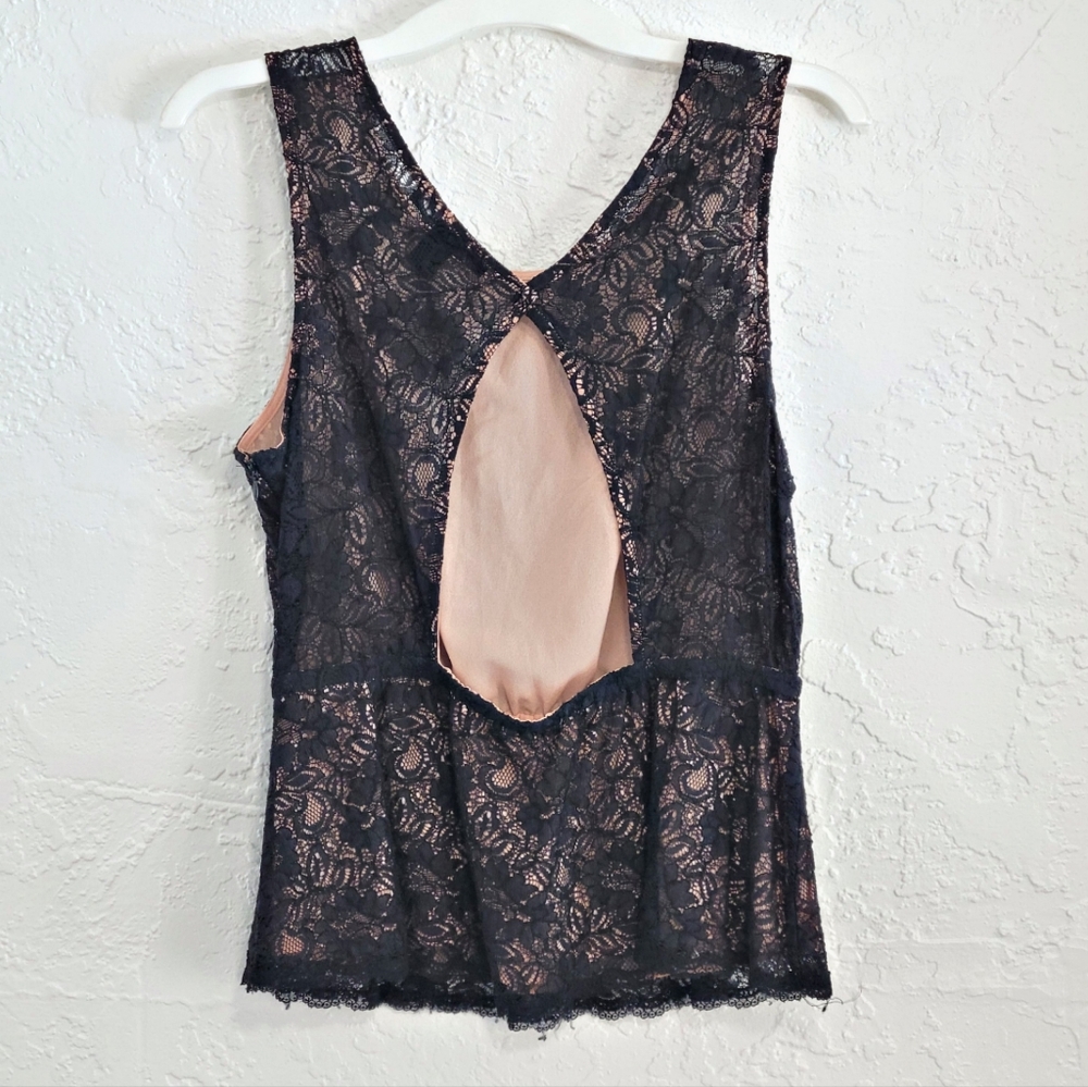 Forever 21 Black Peplum Sleevless blouse with back cutout